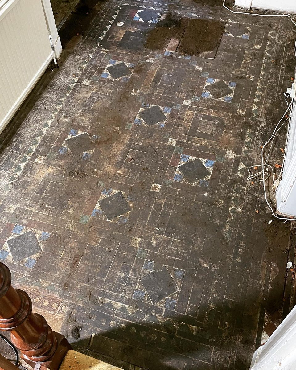 The original encaustic tiles run all the way down the hall (1/4)