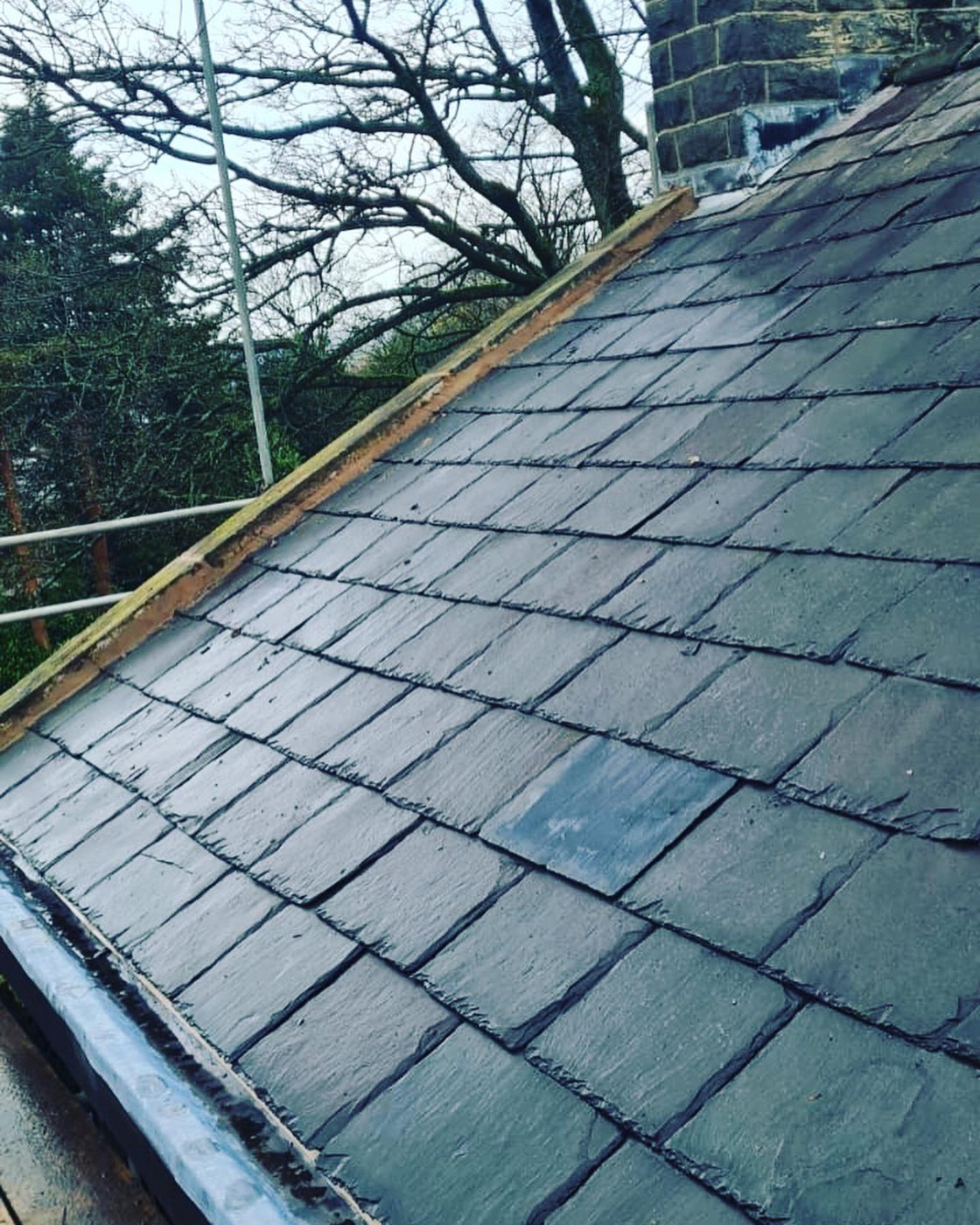 The newly relaid slate roof